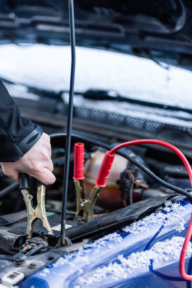 Emergency jump start service in the Bronx during a cold winter day.